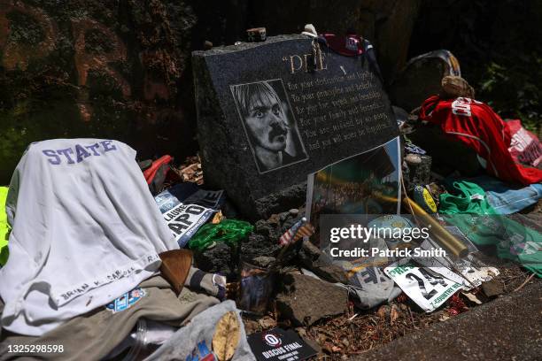 Memorabilia, shoes and other relics are seen at the Prefontaine Memorial, a roadside stone memorial dedicated to deeply admired American runner Steve...