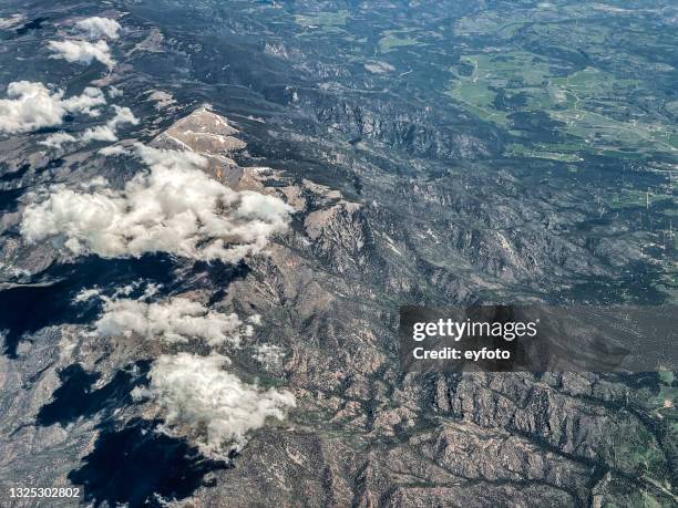 rocky mountains - aerial view of clouds and earth landscape stock pictures, royalty-free photos & images