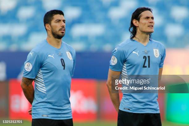 Luis Suarez and Edinson Cavani of Uruguay sing the national anthem prior to a Group A match between Bolivia and Uruguay as part of Copa America...