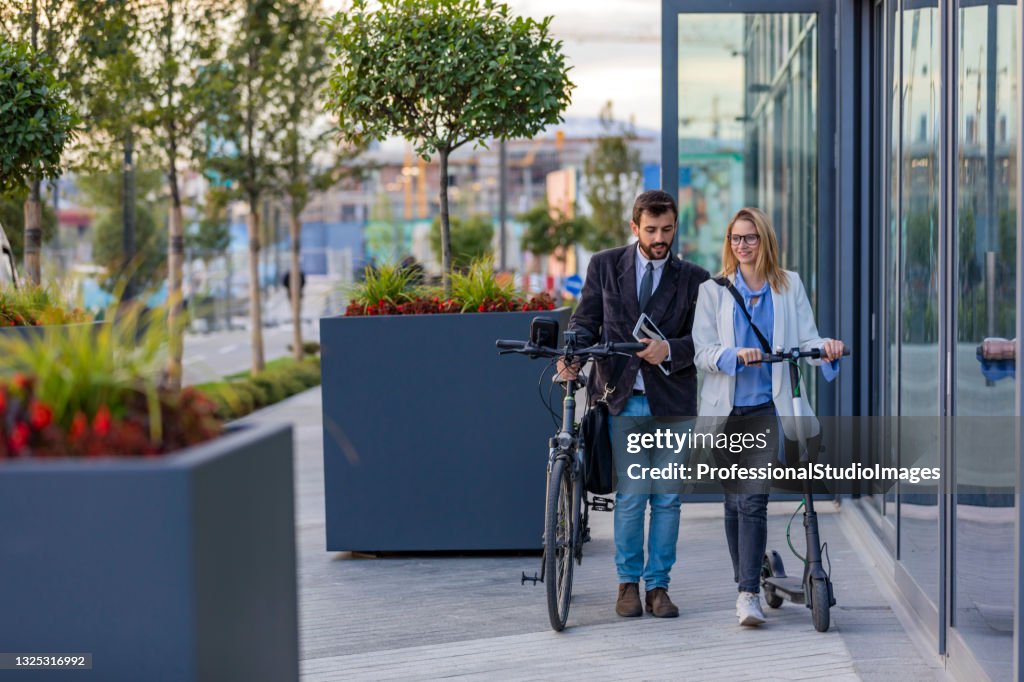 Smiling Business Couple Outdoors in the Street. Business Communication Between Young Couple.