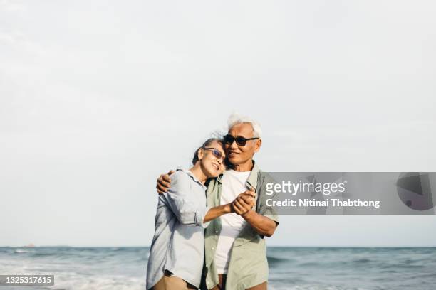 retirement concept and happy life. - interracial wife fotos stock-fotos und bilder