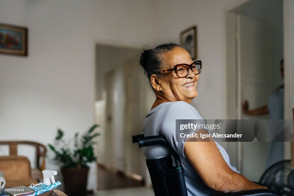 Happy elderly woman in the wheelchair