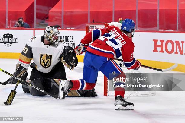 Cole Caufield of the Montreal Canadiens scores a goal against Robin Lehner of the Vegas Golden Knights during the second period in Game Six of the...