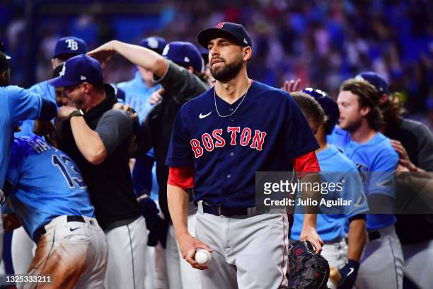 Matt Barnes of the Boston Red Sox reacts after throwing a wild pitch in the ninth inning against the Tampa Bay Rays at Tropicana Field on June 24,...
