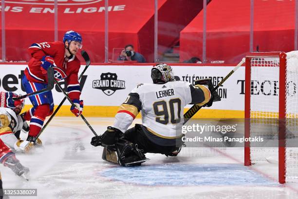 Artturi Lehkonen of the Montreal Canadiens scores the game-winning goal past Robin Lehner of the Vegas Golden Knights during the first overtime...