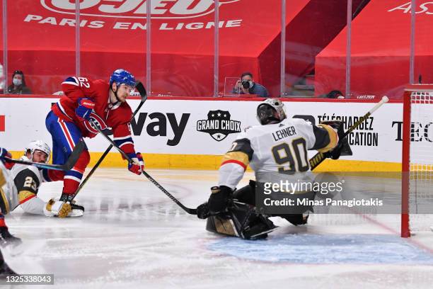 Artturi Lehkonen of the Montreal Canadiens scores the game-winning goal past Robin Lehner of the Vegas Golden Knights during the first overtime...