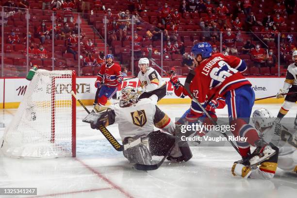 Artturi Lehkonen of the Montreal Canadiens scores the game-winning goal past Robin Lehner of the Vegas Golden Knights during the first overtime...