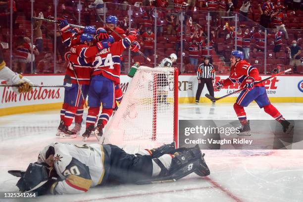 Robin Lehner of the Vegas Golden Knights reacts after allowing the game-winning overtime goal to Artturi Lehkonen of the Montreal Canadiens who is...