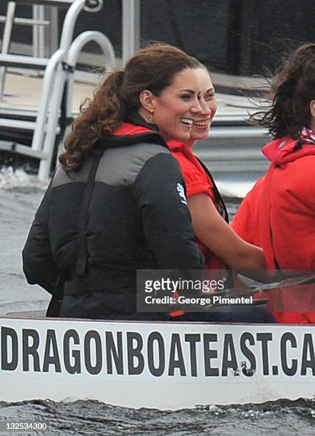 Catherine, Duchess of Cambridge rows in a dragon boat across Dalvay lake on July 4, 2011 in Charlottetown, Canada.
