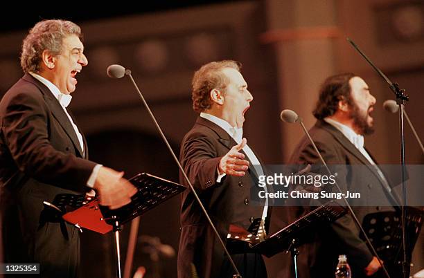 Left to right, Placido Domingo, Jose Carreras and Luciano Pavarotti sing during the Three Tenors'' concert June 22, 2001 at Chamsil Olympic stadium...