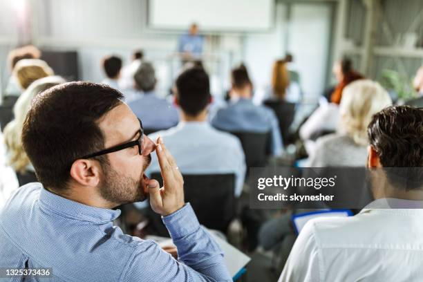 this seminar is so boring! - yawn office stock pictures, royalty-free photos & images