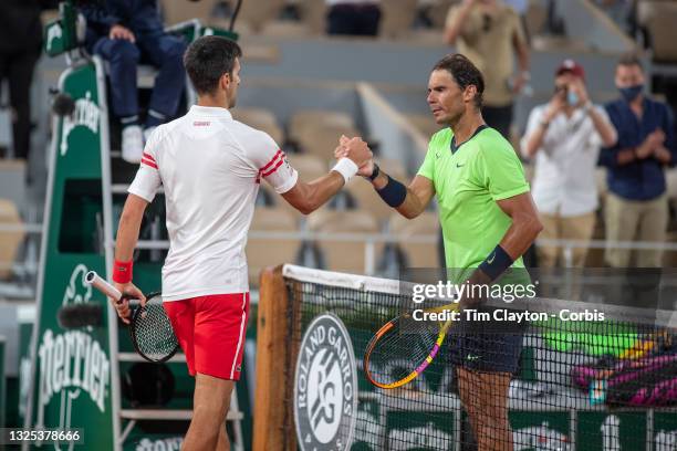 June 11. Winner Novak Djokovic of Serbia is congratulated at the net by Rafael Nadal of Spain after their match on Court Philippe-Chatrier during the...