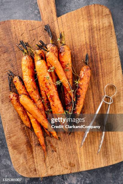 oven roasted carrots - carrot stock pictures, royalty-free photos & images