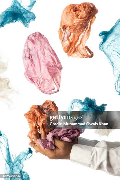 cropped hand holding plastic bag - disposable stock pictures, royalty-free photos & images