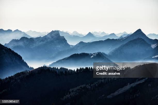 swiss alps seen from mount kronberg in the appenzell alps - mountain stock pictures, royalty-free photos & images
