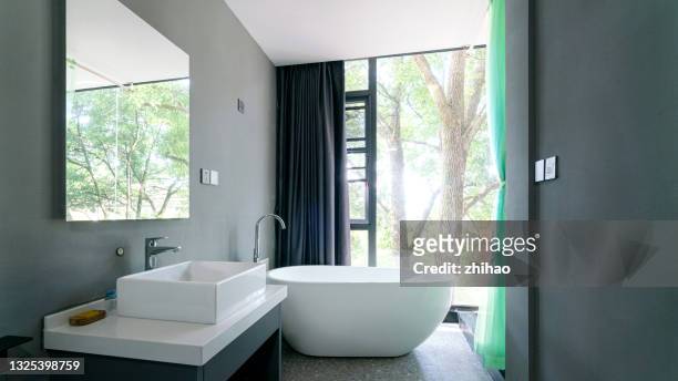 washbasins and bathtubs in luxury hotels - bathroom foto e immagini stock