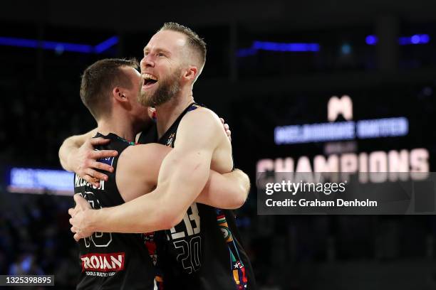 Mitch McCarron and David Barlow of Melbourne United celebrate victory during game three of the NBL Grand Final Series between Melbourne United and...