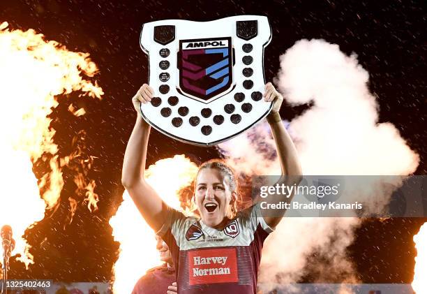 Ali Brigginshaw of Queensland holds up the shield as she celebrates victory after the Women's Rugby League State of Origin match at the Sunshine...