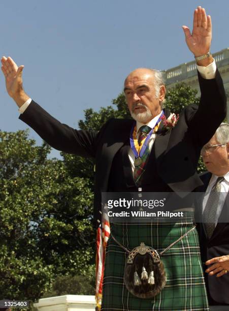 Actor Sean Connery waves after accepting the William Wallace Award April 5, 2001 on the steps of the Capitol building in Washington, DC. This is the...