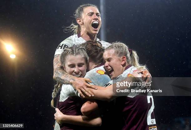 Tamika Upton of Queensland celebrates with team mates during the Women's Rugby League State of Origin match at the Sunshine Coast Stadium on June 25,...