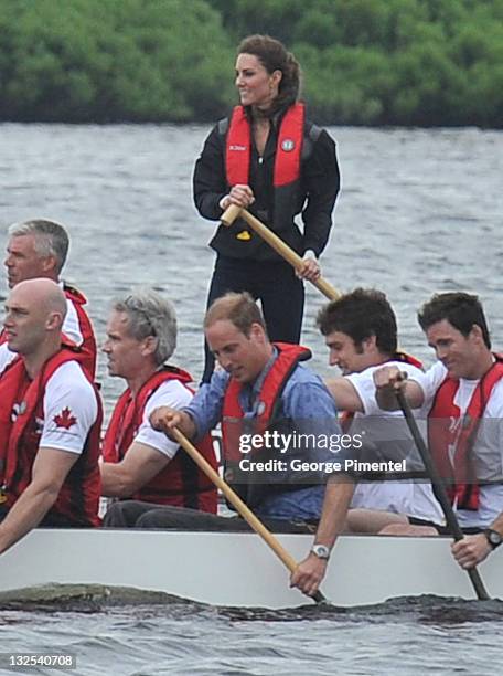 Catherine, Duchess of Cambridge and Prince William, Duke of Cambridge row in a dragon boat across Dalvay Lake on July 4, 2011 in Charlottetown,...