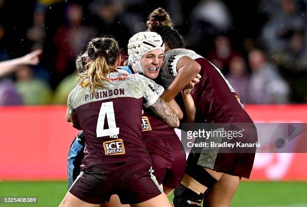 Hannah Southwell of New South Wales is tackled during the Women's Rugby League State of Origin match at the Sunshine Coast Stadium on June 25, 2021...