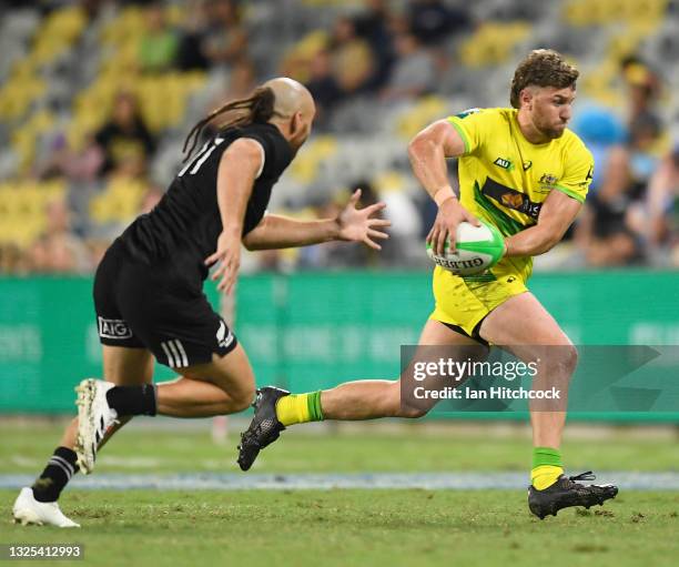 Lewis Holland of Australia gets away from Joe Webber of New Zealand during the Oceania Sevens Challenge match between New Zealand and Australia at...