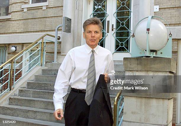 Representative Gary Condit leaves his apartment building in the morning July 12, 2001 in Washington, DC.