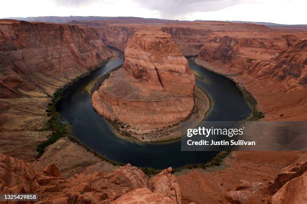 In this aerial view, A view of the Colorado River as it flows around Horseshoe Bend on June 23, 2021 in Page, Arizona. As severe drought grips parts...