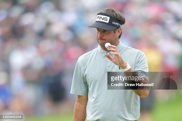 Bubba Watson of the United States reacts to his putt on the eighth green during the second round of the Travelers Championship at TPC River Highlands...