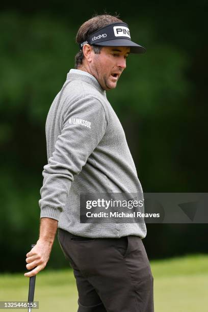 Bubba Watson of the United States reacts to his missed putt on the tenth green during the second round of the Travelers Championship at TPC River...