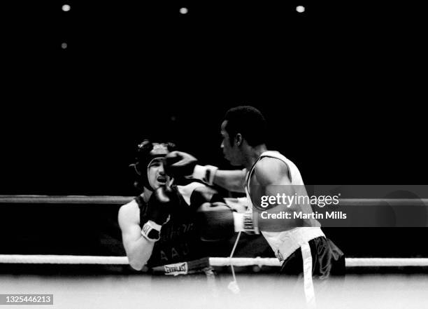 Amateur boxer Bobby Lee Hunter of the United States punches amateur boxer Gary Griffin of the United States during their light flyweight match on...