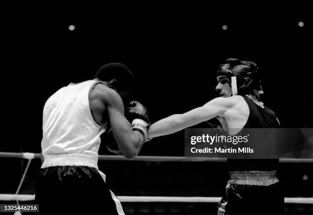 Amateur boxer Gary Griffin of the United States punches amateur boxer Bobby Lee Hunter of the United States during their light flyweight match on...