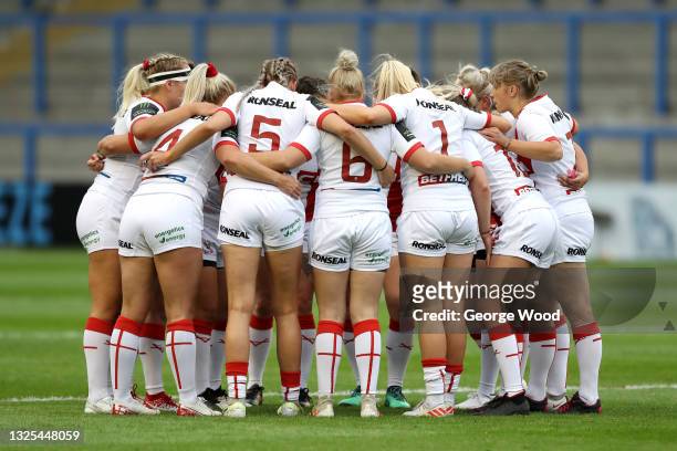 Players of England form a huddle prior to the Rugby League International match between England Women and Wales Women at The Halliwell Jones Stadium...