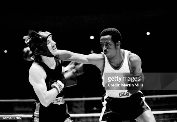 Amateur boxer Bobby Lee Hunter of the United States punches amateur boxer Gary Griffin of the United States during their light flyweight match on...