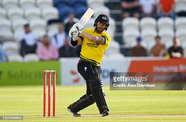 Chris Dent of Gloucestershire hits out during the Vitality T20 Blast match between Sussex Sharks and Gloucestershire at The 1st Central County Ground...