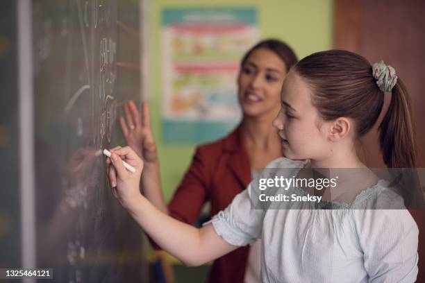 Writing In Board School Student Writing On Board Photos and Premium High Res Pictures - Getty ...