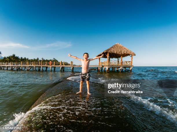 boy swimming in cancun - cancun stock pictures, royalty-free photos & images