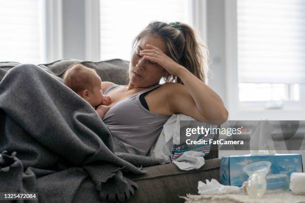 postpartum stress - sad mum stock pictures, royalty-free photos & images