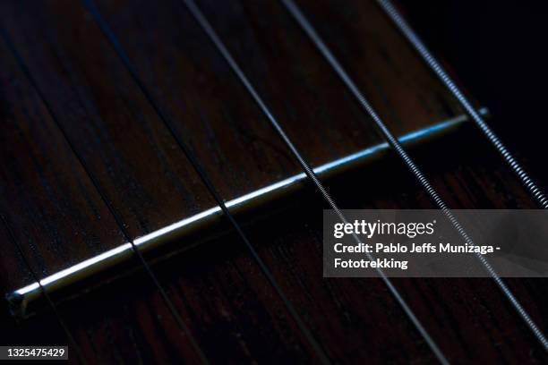 close-up detail on guitar - musical instrument string stock pictures, royalty-free photos & images