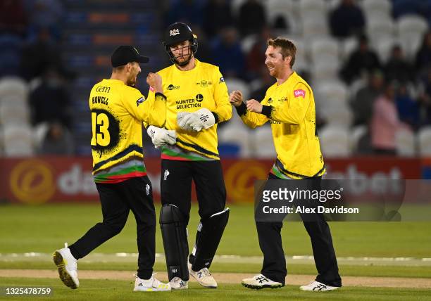 James Bracey , Benny Howell and Tom Smith of Gloucestershire celebrate the wicket of Will Beer of Sussex during the Vitality T20 Blast match between...