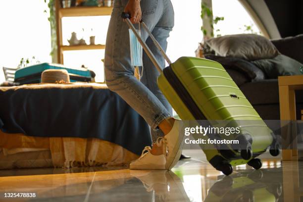 woman returning home from travel - escape the room event stock pictures, royalty-free photos & images