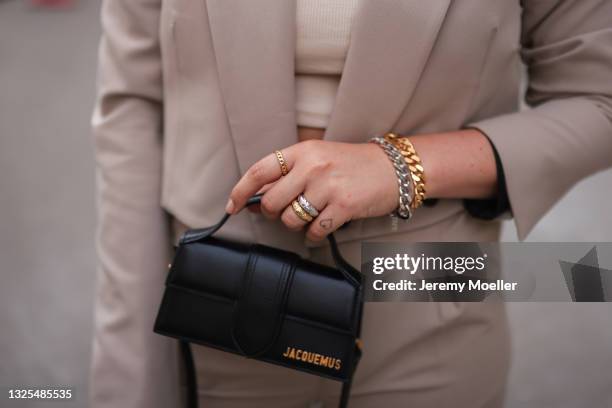 Franzi Koenig wearing light brown Zara blazer, light brown NAKD pants, black Jacquemus mini leather bag and Fafe Collection jewelry on June 18, 2021...