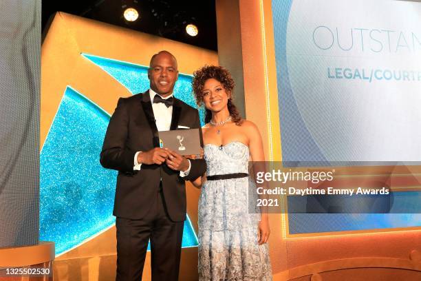 In this image released on June 25, Kevin Frazier and Nischelle Turner pose during the 48th Annual Daytime Emmy Awards broadcast on June 25, 2021.