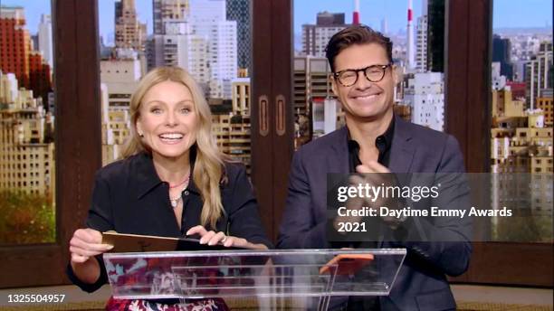 In this screenshot released on June 25, Kelly Ripa and Ryan Seacrest speak during the 48th Annual Daytime Emmy Awards broadcast on June 25, 2021.