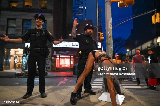 Member of the NYPD dances with Mary Magdeline during the 27th Annual New York City Drag March on June 25, 2021 in New York City. The annual Drag...