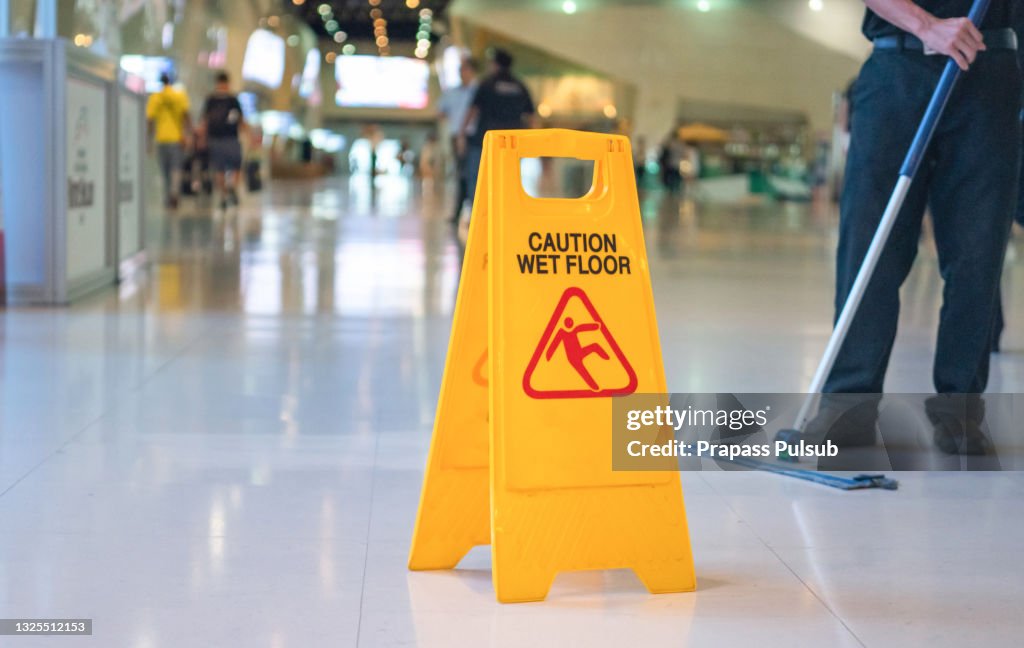 Wet floor caution sign on floor