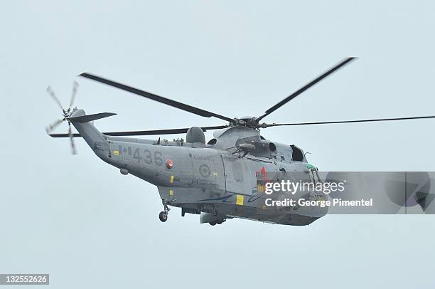 Prince William, Duke of Cambridge takes part in a demonstration of waterbirding during an exercise in a Sea King Helicopter on July 4, 2011 in...