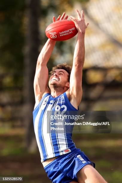 Flynn Appleby of the Kangaroos takes a mark during the round 11 VFL match between the North Melbourne Kangaroos and the Werribee Tigers at Arden...