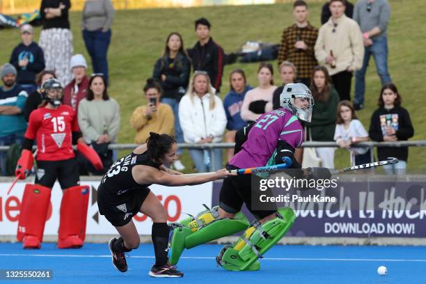 Julia King of the Black Sticks scores against Rachael Lynch of the Hockeyroos in the shoot out during the FIH Pro League match between the Australian...
